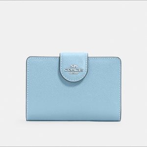 Medium corner zip wallet in waterfall blue with silver hardware.